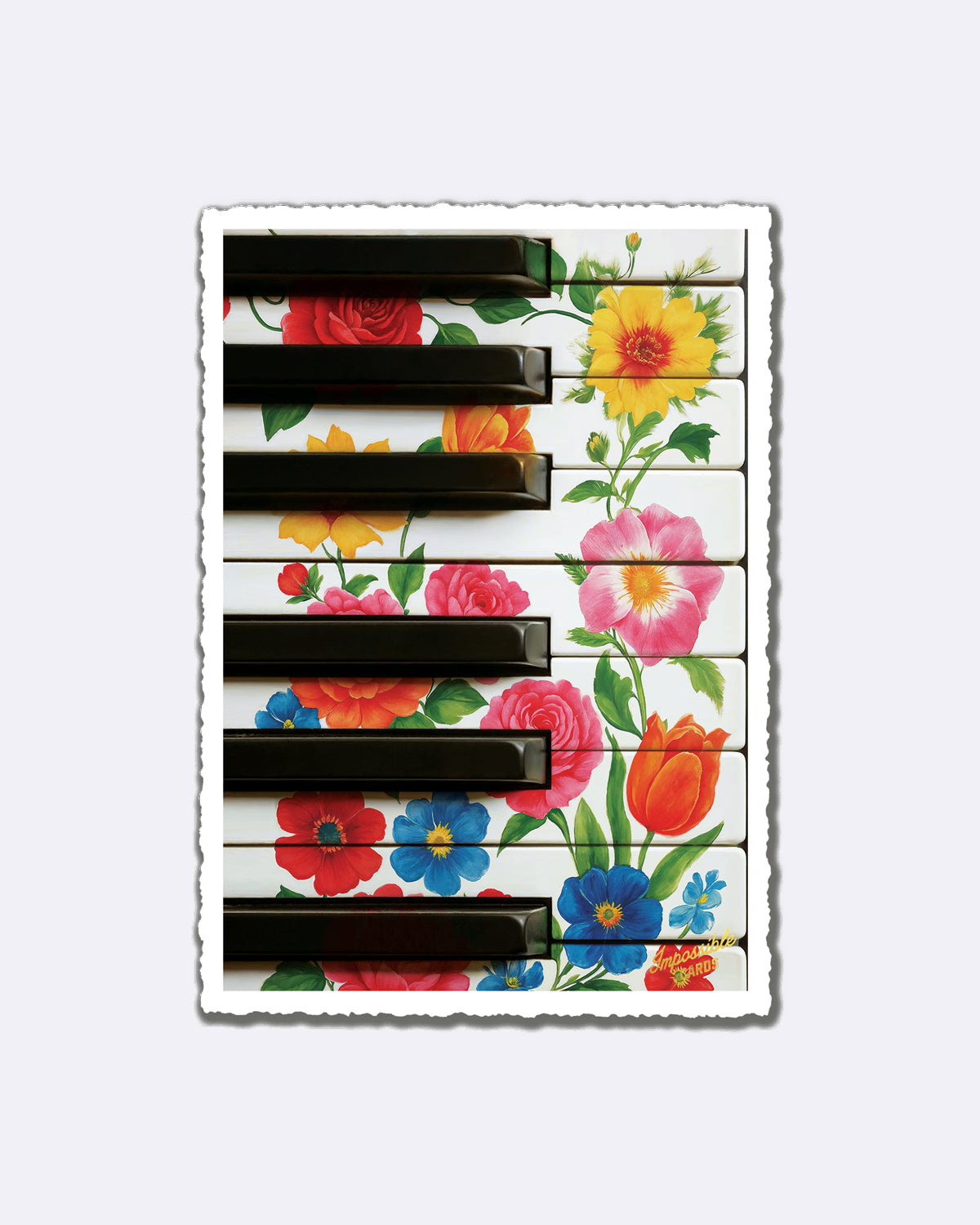 Postkarte mit Blumenmuster auf Klaviertasten und Schriftzug "Impossible Card"